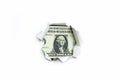 One dollar in a hole on a white background. Royalty Free Stock Photo