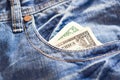 One dollar in jeans Royalty Free Stock Photo