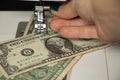 one dollar lies on a sewing machine, money production, finance, income