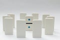 One domino surrounded by other dominoes Royalty Free Stock Photo