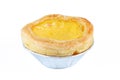 One egg tart on foiled container isolated on white