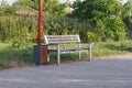 One empty brown wooden bench and urn Royalty Free Stock Photo