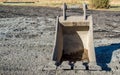 One empty bulldozer bucket at a construction site