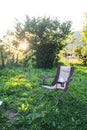 one empty folding chair for Outdoor Camping in nature background on sunset