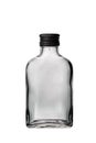 One empty liquor alcohol glass russian vodka bottle with black cap and isolated on a white background Royalty Free Stock Photo