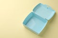 One empty lunch box on beige background, above view. Space for text Royalty Free Stock Photo