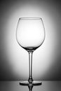 One empty wineglass for red wine on diffusion lit background Royalty Free Stock Photo