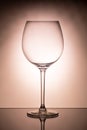 One empty wineglass for red wine on diffusion lit background Royalty Free Stock Photo