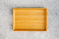 One empty wooden tray on gray stone table. Top view Mock up Royalty Free Stock Photo