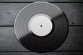 One EP vinyl record with blank label on black wooden background