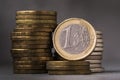 One euro on the background of various coins