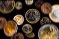 One Euro coin closeup on a black background. In the background a Royalty Free Stock Photo