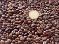 One euro coin closeup on coffee beans background