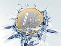 One euro coin is falling into water Royalty Free Stock Photo