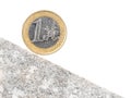 One Euro coin on inclined plane