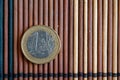 One euro coin lie on wooden bamboo table Denomination is one euro Royalty Free Stock Photo