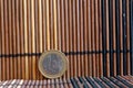 One euro coin lie on wooden bamboo table Denomination is 1 euro Royalty Free Stock Photo