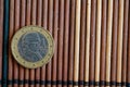 One euro coin lie on wooden bamboo table Denomination is 2 euro - back side Royalty Free Stock Photo