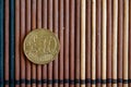 One euro coin lie on wooden bamboo table Denomination is 10 euro cent Royalty Free Stock Photo