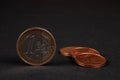 One euro coin and two cent on a dark background Royalty Free Stock Photo