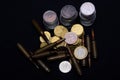 One euro, Russian ruble and small Ukrainian coins with rifle military ammo on black background. Symbolizes war for money- biggest Royalty Free Stock Photo