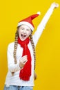 One Expressive Caucasian Girl in Santa Festive Hat and Red Scarf Having Fun With Vivid Bright Burning Bengal Light Fireworks With