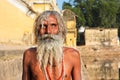 One eye blind poor man has sun bathing outdoor