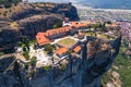 One of the famous Greek monasteries perched on the edge of sandstone peaks seen from drone perspective. Beautiful
