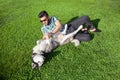 One fashion middle eastern man with beard and fashion hair style is resting and enjoy on beautiful green grass . Royalty Free Stock Photo