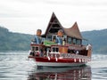 One of the ferries that cross Lake Toba with the typical decoration of the area