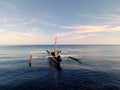 One fishing boat mooring on calm sea water