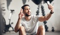 One fit young hispanic man listening to music with earphones from a cellphone and gesturing a peace sign for selfies Royalty Free Stock Photo