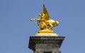 One of four gilt-bronze statues of Fame The Pont Alexandre III bridge Paris Royalty Free Stock Photo