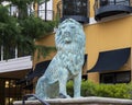 One of four life size bronze lion sculptures that flank steps at The Village at Sports Center in Arlington, Texas.