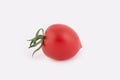 One fresh cherry tomato isolated on white background. Royalty Free Stock Photo