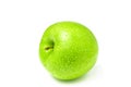 One fresh green apple with water drops on white background Royalty Free Stock Photo