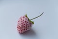 One fresh red strawberry on a white background. Royalty Free Stock Photo