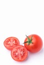 One fresh red tomatoes organic and tomato two slices isolated on white background. Royalty Free Stock Photo