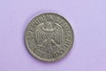 One german Mark coin marked Bundesrepublik Deutschland from 1968 on purple background..