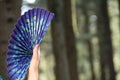 One girl holding peacock feather fan. details Royalty Free Stock Photo
