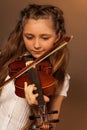 One girl playing the violin on gel background Royalty Free Stock Photo