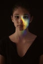 One girl portrait, face head, prism dispersion of light into colorful rainbow