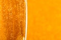 One glass of champagne on golden blurred background. Macro Royalty Free Stock Photo