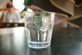 One glass of sparkling water isolated on black table Royalty Free Stock Photo