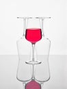 One glass of wine and two upside down Royalty Free Stock Photo