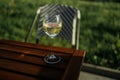 One glass of wine white standing on a table outdoors in the sun light Royalty Free Stock Photo