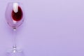 One glasses of red wine at wine tasting. Concept of red wine on colored background. Top view, flat lay design Royalty Free Stock Photo