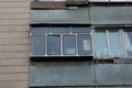 One gray closed balcony on a brown wall