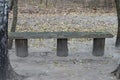 One gray empty old wooden bench stands on the ground Royalty Free Stock Photo