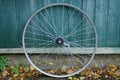 One gray metal bicycle wheel Royalty Free Stock Photo